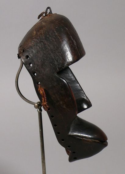 null Zooanthropomorphic mask made of hardwood with a dark glossy patina, showing...