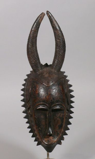 null Hardwood mask with a dark, partly crusty patina showing a fine face topped with...