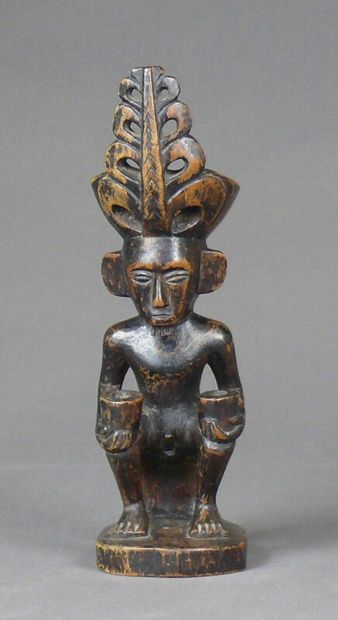 null Statuette of an ancestor "Adu" in wood with dark patina representing a male...