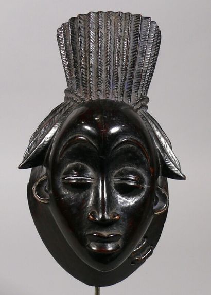 null Hardwood "Ikwara" mask with a dark lacquered patina and traces of indigo pigment...