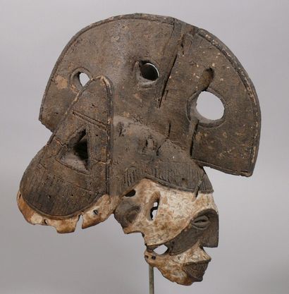 null Agbogho mmuo" mask in medium-hard wood with a dark crusty patina and pembe highlights,...