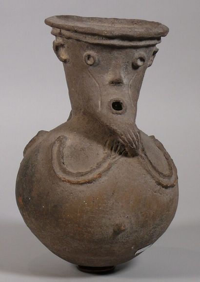 null Anthropomorphic beer pot in gray terra cotta with a globular body, the Janus...