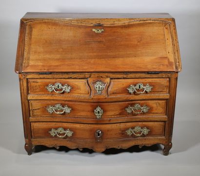 null Chest of drawers in walnut with a crossbow front opening in the upper part by...