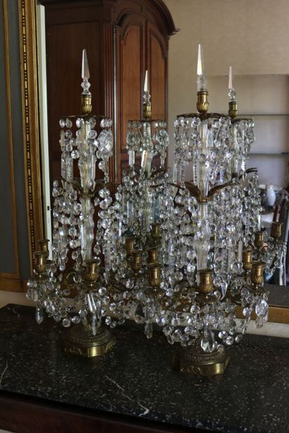 null Pair of six lights girandoles, crystal and bronze. 

H. 83 cm

accident to the...