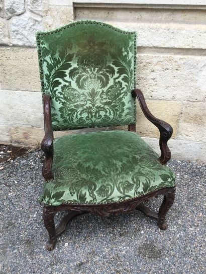 null Regency period armchair in natural wood, the armrests and the base joined by...