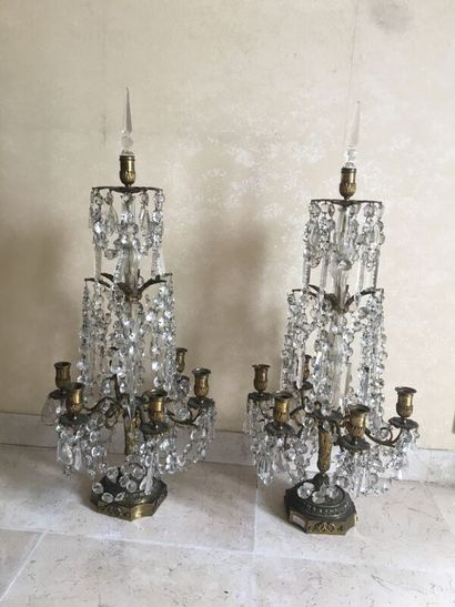 null Pair of six lights girandoles, crystal and bronze. 

H. 83 cm

accident to the...
