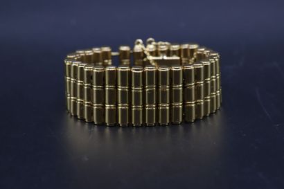 null Yellow gold bracelet 750 thousandths with cylindrical links pierced in two places...