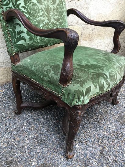 null Regency period armchair in natural wood, the armrests and the base joined by...