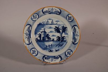 null DELFT

Plate decorated with blue monochrome in the center of a factory in a...