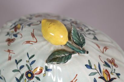 null ROUEN 

A bowl, a lid and an oval dish with polychrome decoration of large bouquet...