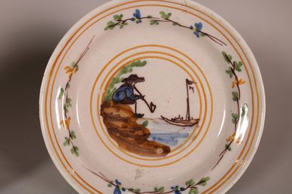 null MOULINS

Plate with polychrome decoration of a man of quality standing on a...