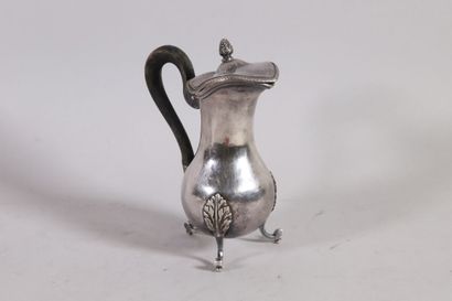 null Silver selfish coffeepot, baluster shape, wooden handle, resting on three feet.

Paris...