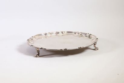 null Silver tray, probably with bills, with a contoured edge with a net formed by...