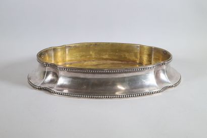 null Oval silver planter with pinched ribs, the edges underlined by a frieze of pearls....