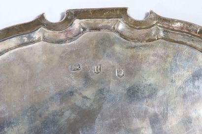 null Silver tray, probably with bills, with a contoured edge with a net formed by...