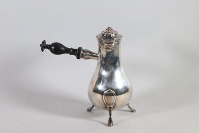 null A baluster-shaped silver coffee pot with a plain body engraved with a coat of...