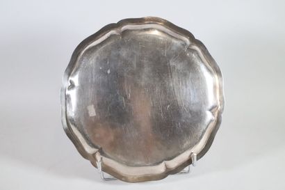 null Round silver dish with contoured edge, the center engraved with a coat of arms...