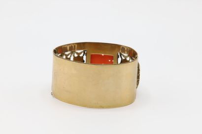 null Gold-plated cuff bracelet decorated with a coral stone engraved imitation of...