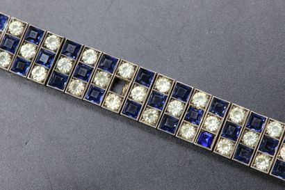 null Silver bracelet decorated with blue and white imitation stones. Gross weight:...