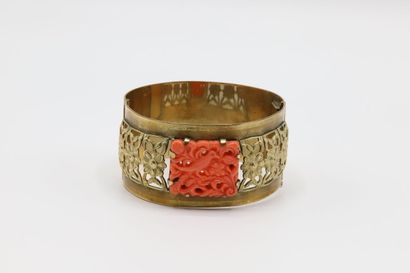 null Gold-plated cuff bracelet decorated with a coral stone engraved imitation of...