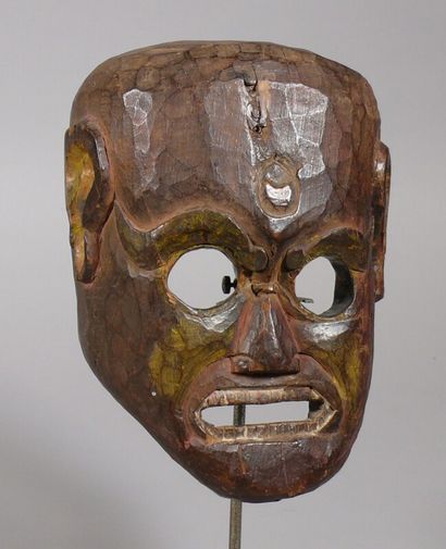 null Hardwood "Krodha" mask with a dark patina and traces of polychromy depicting...