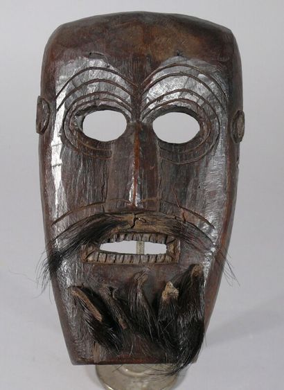 null Hardwood dance mask with dark patina of use featuring a long face with engraved...