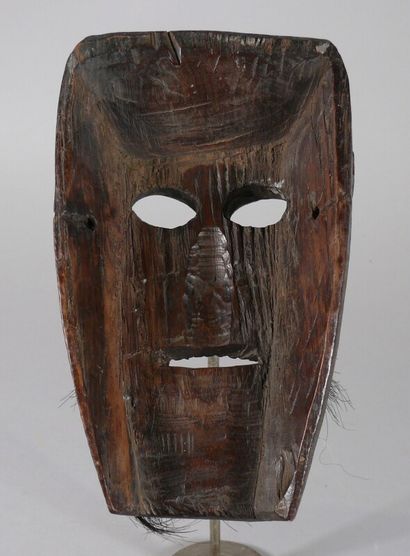 null Hardwood dance mask with dark patina of use featuring a long face with engraved...