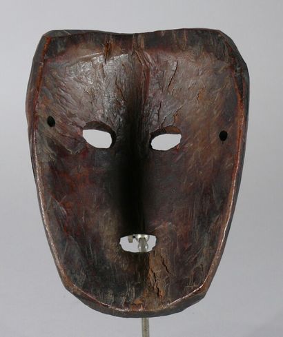 null Hardwood dance mask with dark patina of use showing a flat face, engraved eyebrows,...