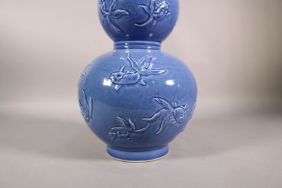 null China - Double gourd vase in porcelain with blue background and fishes decoration...