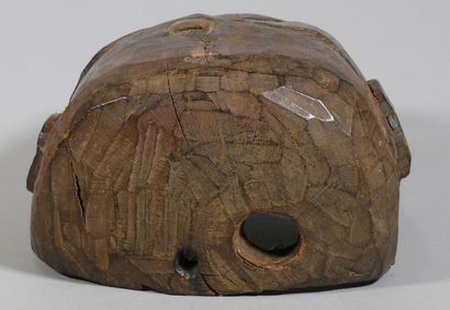 null Hardwood "Krodha" mask with a dark patina and traces of polychromy depicting...