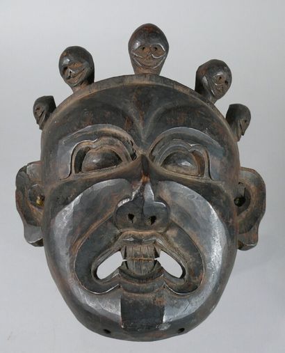 null Hardwood "Krodha" mask with a dark patina of use, depicting a grimacing deity...