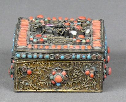 null Rectangular brass box with fine floral filigree decoration enhanced with coral,...