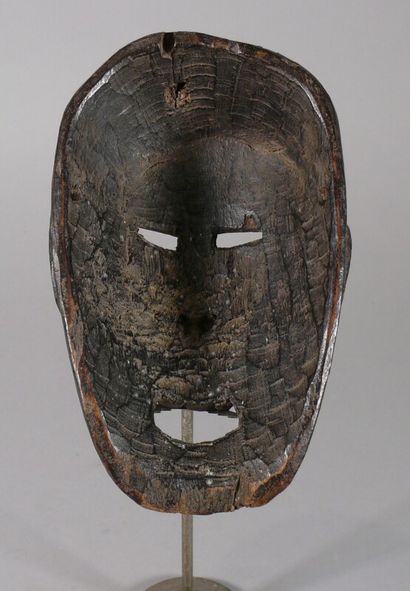 null Hardwood dance mask with a beautiful dark patina of use and vigorous size featuring...