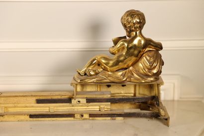 null Gilded bronze mantelpiece and pair of andirons showing children reading,
Louis...