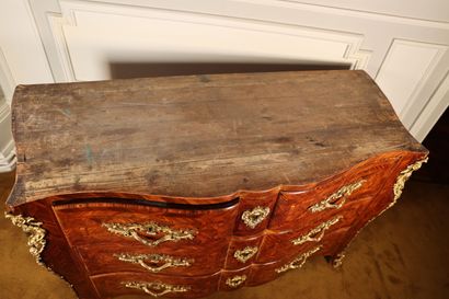 null Veneer chest of drawers with a crossbow front opening with four drawers on three...