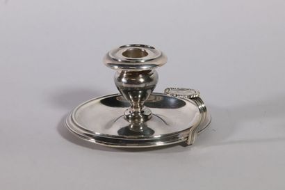 null Hand candlestick in plain silver, the thumb rest engraved with a monogram in...