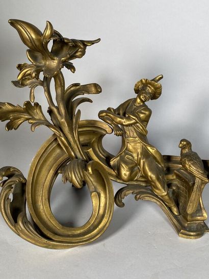 null Pair of bronze andirons with "Chinese" decoration in a rocaille setting
Louis...