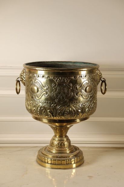 null A repoussé copper cup decorated with palms, scrolls and lions' heads. 
Napoleon...