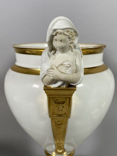 null Porcelain refreshment stand of baluster form resting on a pedestal, the handles...