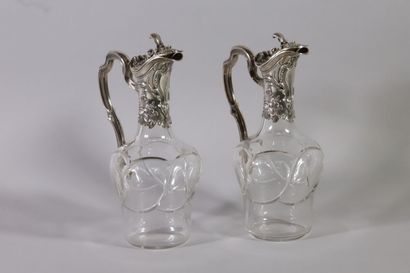 null Pair of ewers, in cut crystal and silver trim with rocaille decoration of cartouches...
