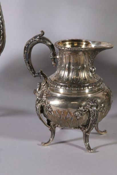 null Four-piece silver service of baluster form decorated with frets, laurels, water...