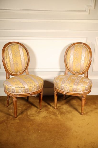 Pair of waxed wood chairs with medallion...