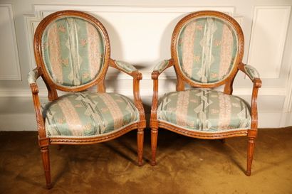 Pair of waxed wood armchairs with carved...