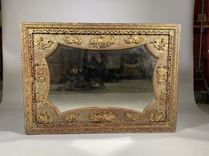 null CHINA 
Large rectangular mirror in carved and gilded wood decorated with vases,...