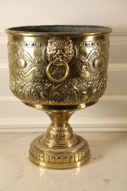 null A repoussé copper cup decorated with palms, scrolls and lions' heads. 
Napoleon...