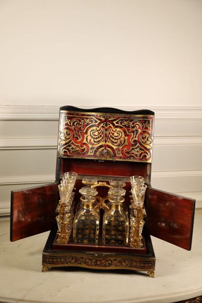 null Boulle style marquetry liquor cabinet including four bottles and sixteen crystal...