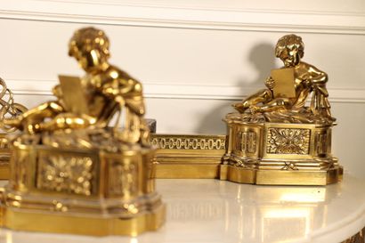 null Gilded bronze mantelpiece and pair of andirons showing children reading,
Louis...