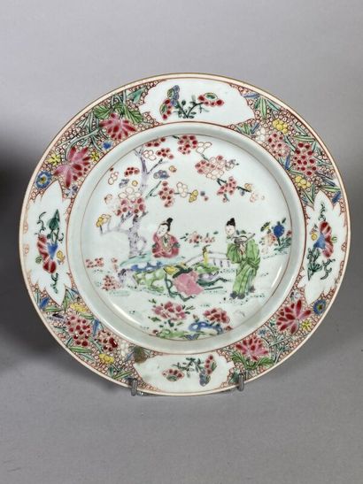 null CHINA 
Three porcelain plates decorated with polychrome enamels of the pink...