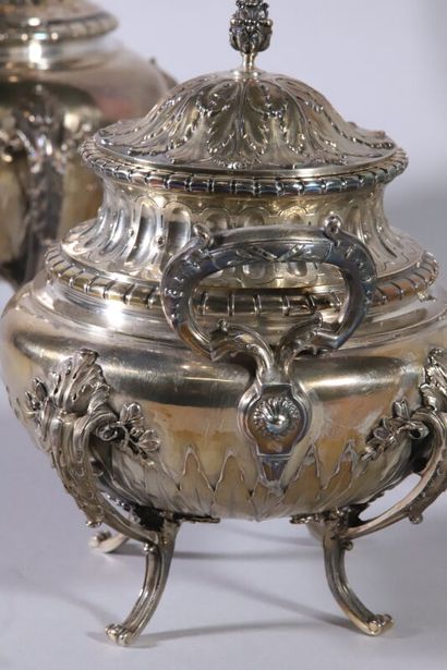 null Four-piece silver service of baluster form decorated with frets, laurels, water...