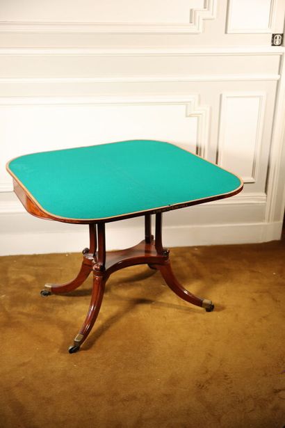 null Mahogany and mahogany veneer game table, the top revealing green felt with blond...